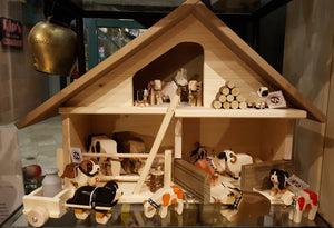 Alpen Schatz is proud to present the popular Marc Trauffer traditional Swiss handcrafted farm figurines carved out of Swiss wood.  These endearing Swiss farm animals and people, including the ever popular Swiss cows, Bernese Mountain Dogs and St Bernards.